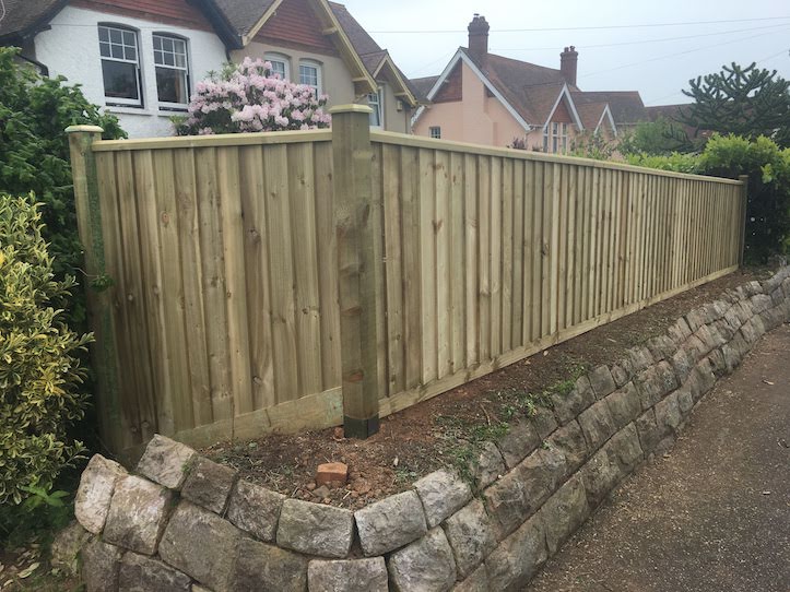 fence built on stone clad bank